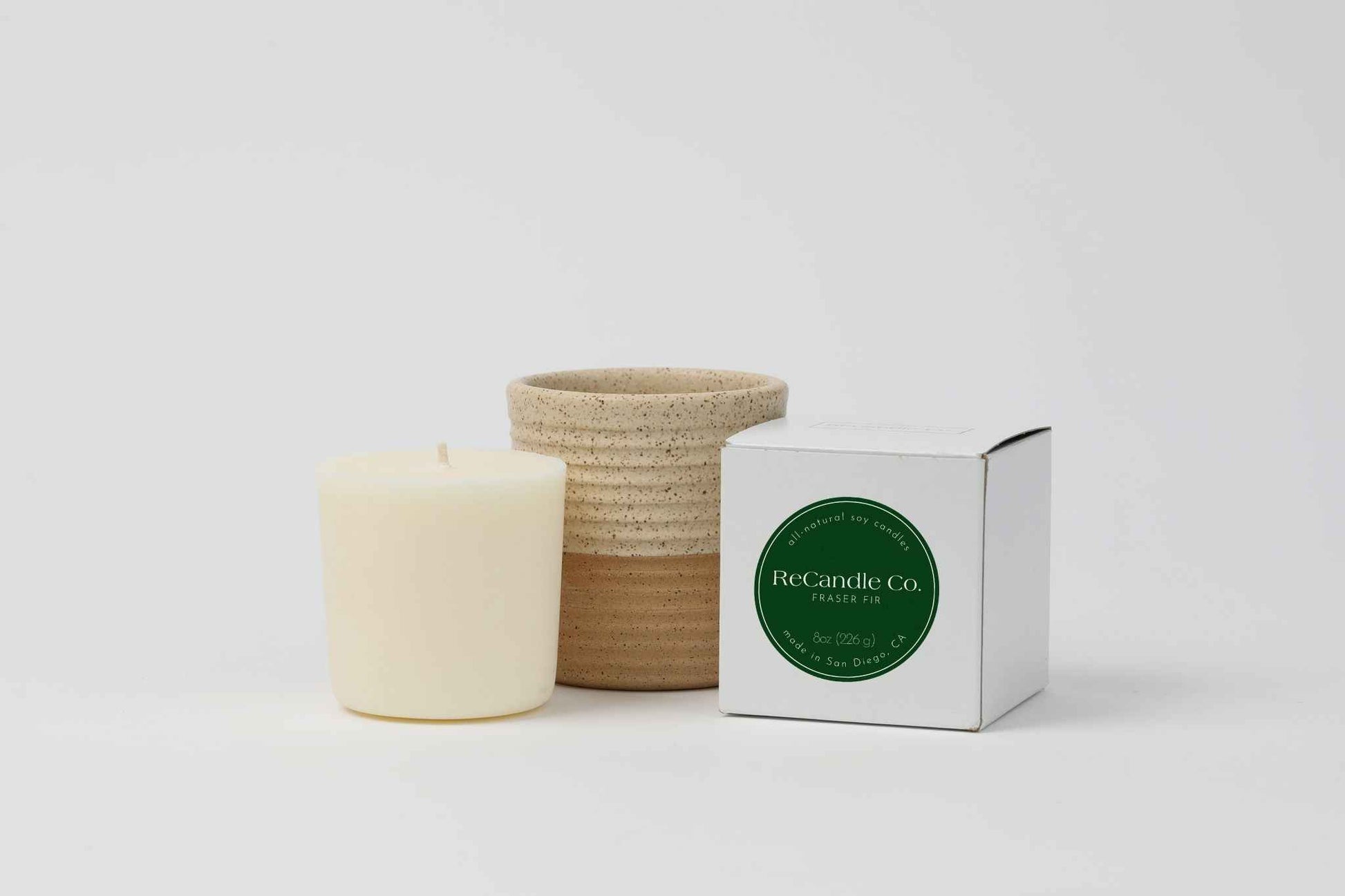 ReCandle Co. Fraser Fir scented refillable candle with a walnut colored ceramic vessel
